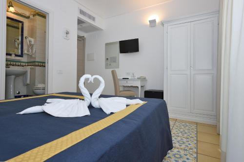 Postel nebo postele na pokoji v ubytování Hotel7Bello