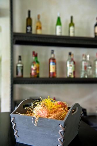 a box of spaghetti and tomatoes on a shelf at Pension Pîrîu' Morii in Gura Humorului