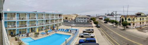 arial view of a city with a pool and buildings at Quebec Motel in Wildwood