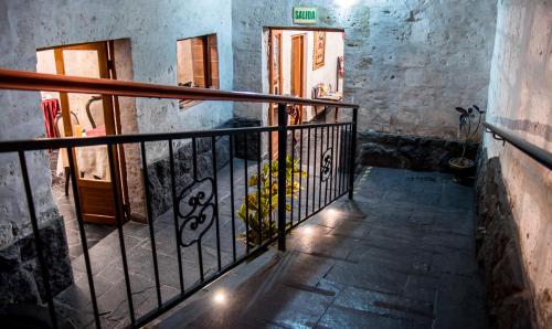 a stairway with a railing with a plant on it at El Portal De San Lázaro in Arequipa