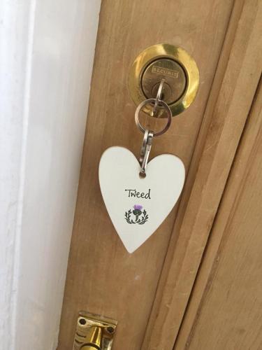a heart key on a door with the word fired at Dryburgh Arms Pub with Rooms in Melrose