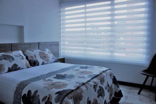 Un ou plusieurs lits dans un hébergement de l'établissement ARI Hotel