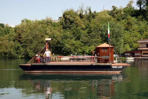 a man standing on a boat in the water at "LA TAVERNA" B&B in Airuno