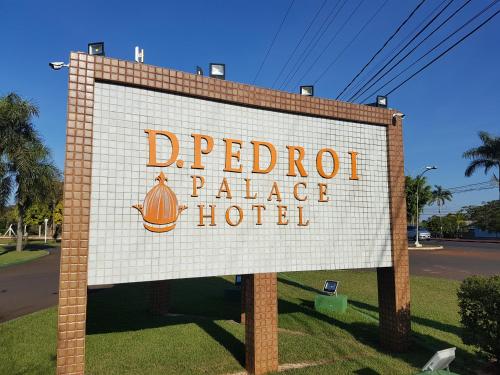 a sign for a pierrot palace hotel on a street at Dom Pedro I Palace Hotel in Foz do Iguaçu