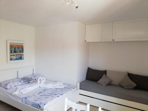 מיטה או מיטות בחדר ב-Apartman Jela Šibenik