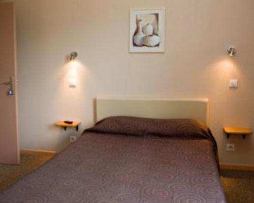 Cama o camas de una habitación en Les Orangers