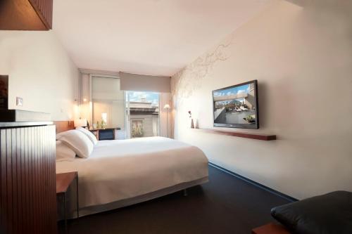 En eller flere senge i et værelse på Hotel Ismael
