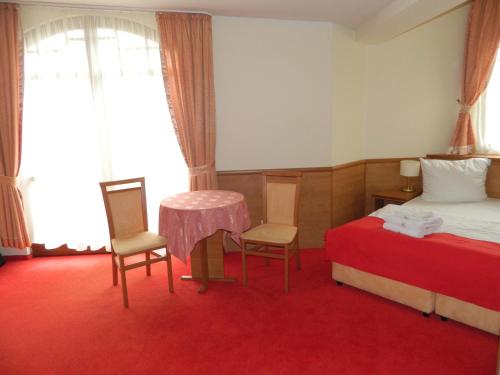 Postel nebo postele na pokoji v ubytování Trofana Wellness & SPA