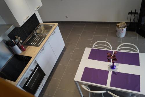 an aerial view of a kitchen with purple and white at La Schleif in Hazelbourg