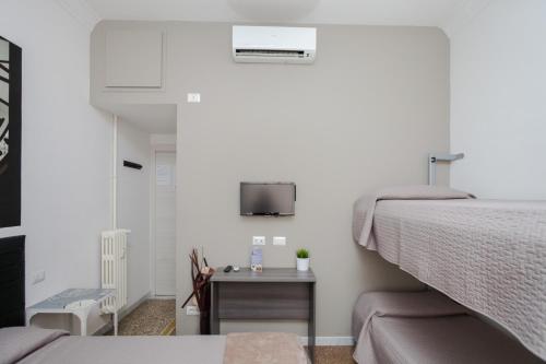 Postel nebo postele na pokoji v ubytování Re di Luna B&B