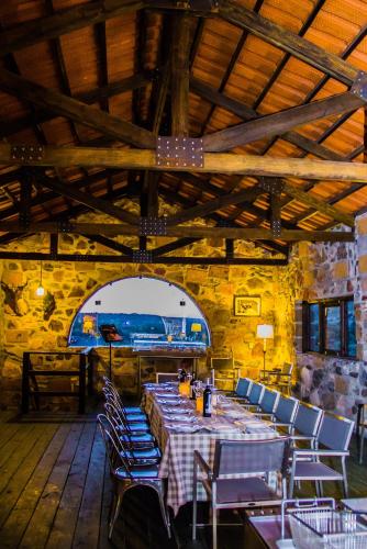 a dining room with a table and chairs in a building at Armadillo Mágico in Armadillo
