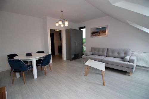 Гостиная зона в Apartamenty Przy Latarni Kropla Bałtyku