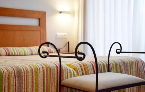 Ένα ή περισσότερα κρεβάτια σε δωμάτιο στο Apartamentos La Barzana