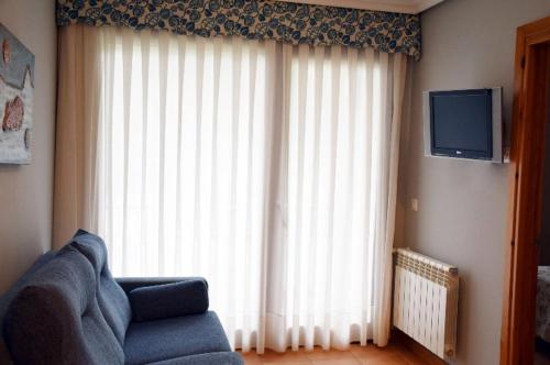 Μια τηλεόραση ή/και κέντρο ψυχαγωγίας στο Apartamentos La Barzana
