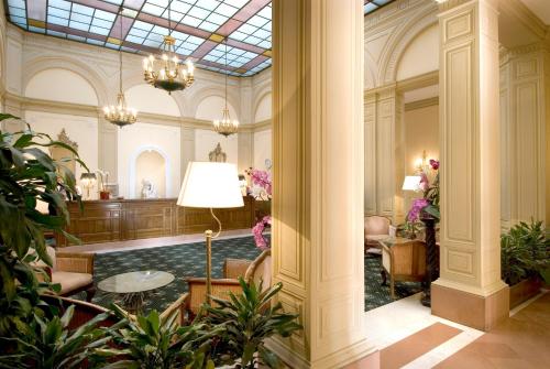 a lobby of a hotel with a room with at Sina Brufani in Perugia