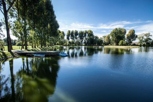 a river with boats in the middle of it at Zamek Topacz in Wrocław