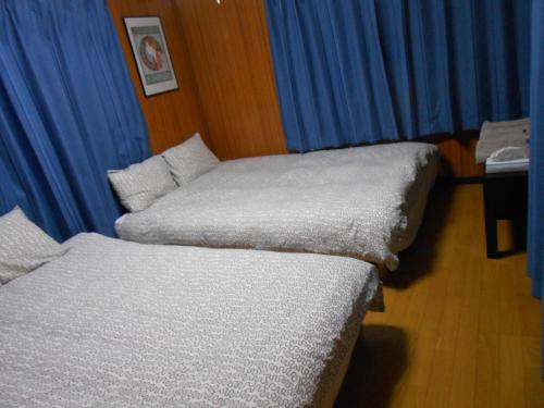 Ένα ή περισσότερα κρεβάτια σε δωμάτιο στο Family Resort Apartment