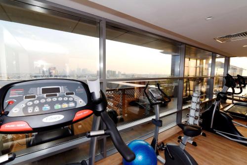 an apartment gym with a view of the city at Best Western Plus Pearl Creek in Dubai