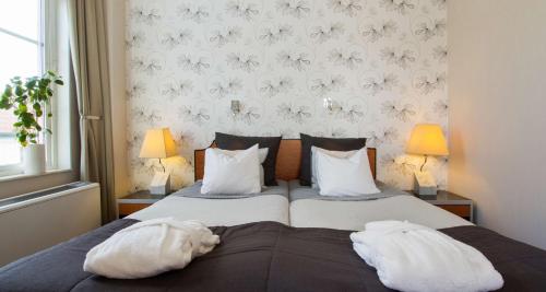 En eller flere senge i et værelse på Best Western Plus Västerviks Stadshotell