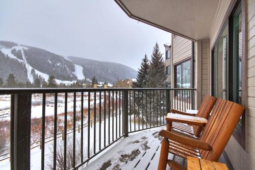 a porch with a bench and a view of a mountain at Cri221 Cinnamon Ridge Condo in Keystone