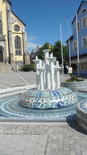 a fountain in the middle of a street at Ferienwohnung "Sonnenschein" in Selb