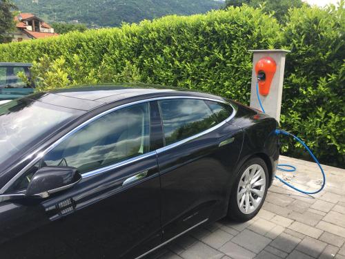 a car is being charged at a hydrogen fueling station at Tullio Hotel in Gravedona