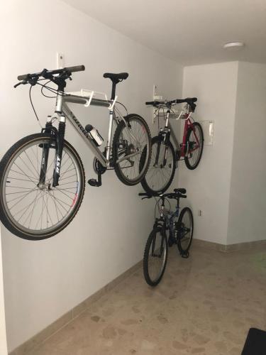 two bikes hanging on a wall in a room at Volcano Rijeka in Rijeka