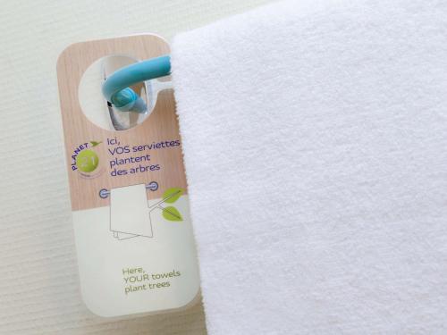 a roll of white paper on a wooden holder at ibis Fortaleza Praia de Iracema in Fortaleza