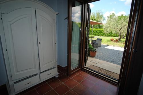 a room with a door leading to a patio at L'Orto sul Poggio in Sutri