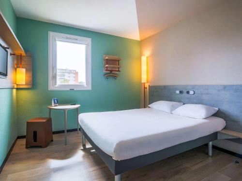 Llit o llits en una habitació de Ibis Budget Albi Centre