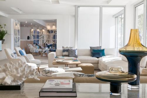 a living room with a couch and a table at Adriana Hvar Spa Hotel in Hvar