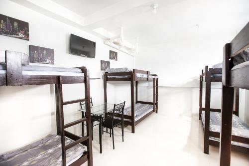 a group of bunk beds in a room at Jaynet Oceanview Resort in Boljoon
