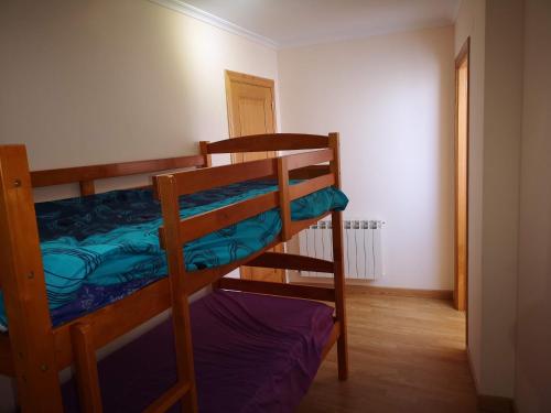 a bedroom with two bunk beds in a room at Duplex Tres Dormitorios Playa A Rapadoira in Foz