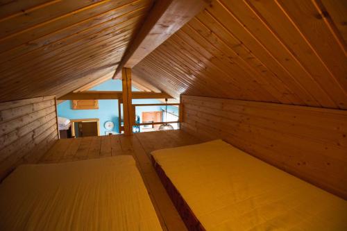 A bed or beds in a room at Aquapark Tatralandia chatka 118