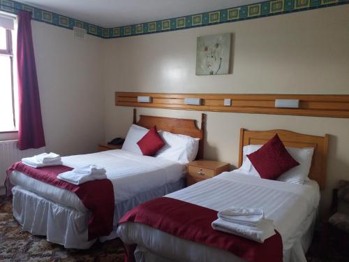 Un ou plusieurs lits dans un hébergement de l'établissement Anno Santo Hotel