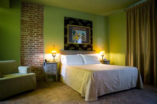 Ένα ή περισσότερα κρεβάτια σε δωμάτιο στο Relais Cascina Scottina