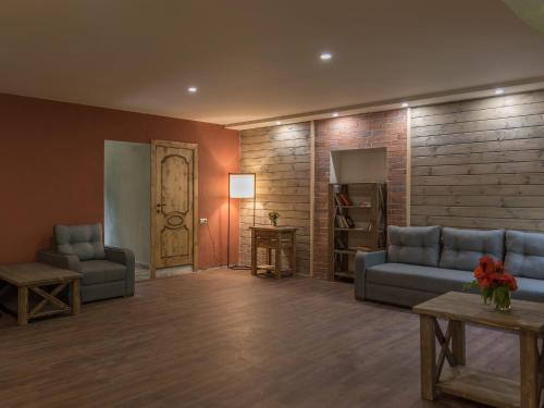 a living room with two couches and a table at Apricot Aghveran Resort in Agveran