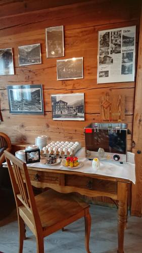 a wooden table with food on top of it at Hotel Nufenen in Ulrichen