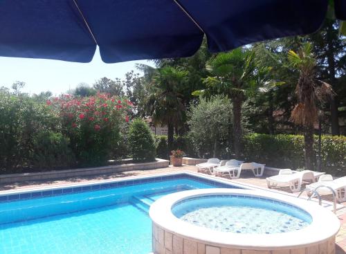 The swimming pool at or close to Apartments Villa Mirjam