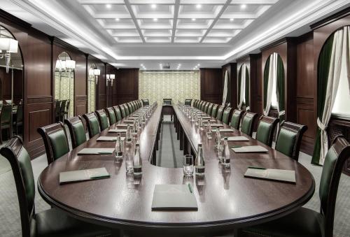 a large conference room with a long table and chairs at London Boutique Hotel in Chişinău