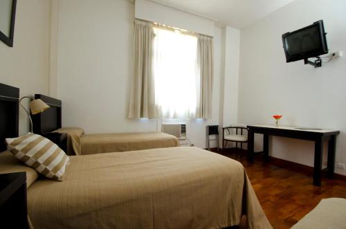 Un pat sau paturi într-o cameră la Hotel Albertina Boutique