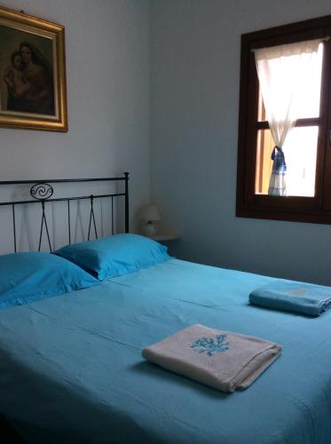 a bedroom with a bed with a towel on it at Tiffany Palau in Palau