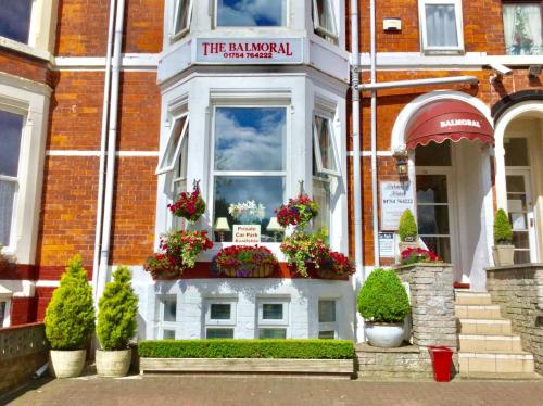 a building with a window with flowers on it at Balmoral in Skegness