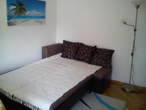 Postel nebo postele na pokoji v ubytování Apartmani Luja