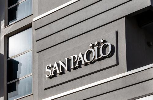 a santa pacific sign on the side of a building at Hotel San Paolo in Rimini