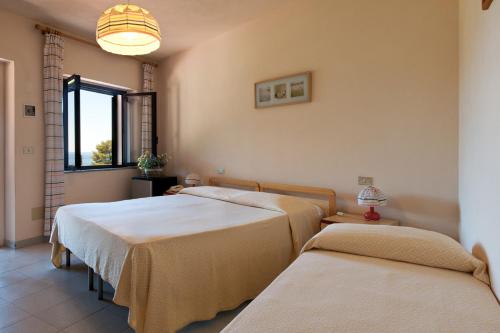 Postel nebo postele na pokoji v ubytování Hotel Casa Rosa
