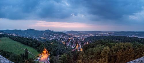 an aerial view of a city at night at Suites MITTE - Aparthotel in Eisenach