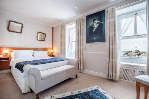 a bedroom with a bed and a window at The Waterfront in Portpatrick