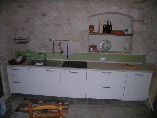 Kuchyň nebo kuchyňský kout v ubytování Masseria del Ponte