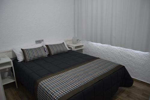 Letto o letti in una camera di Apartamentos AR Muntanya Mar